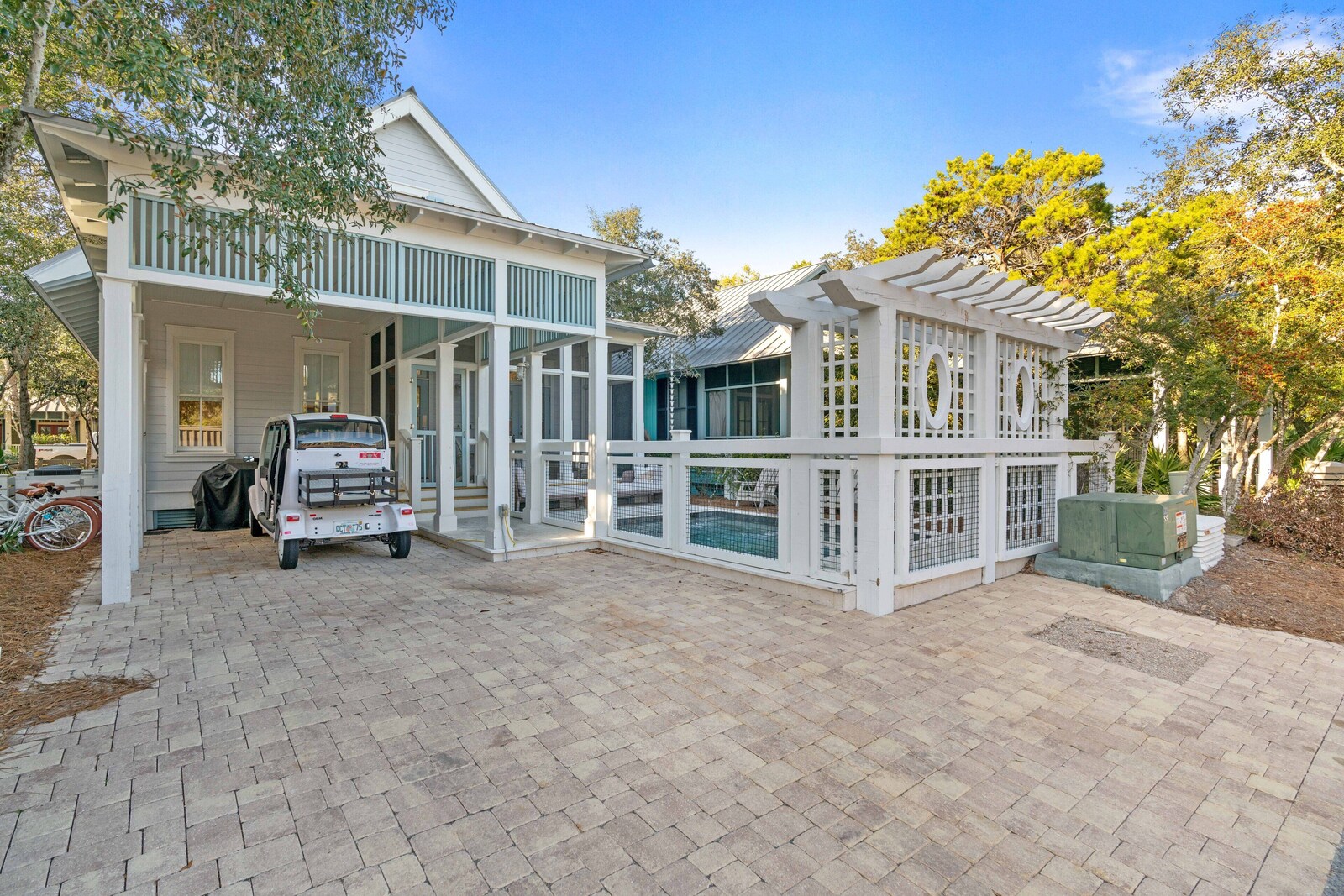 Into the Mystic exterior with covered porch and private pool enclosure