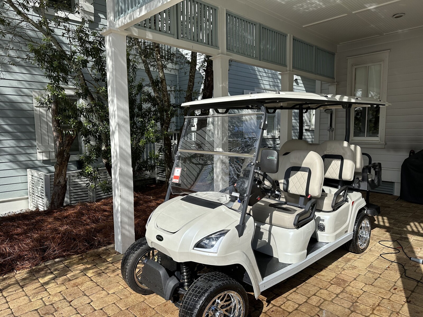 Six-seat golf cart included with the home